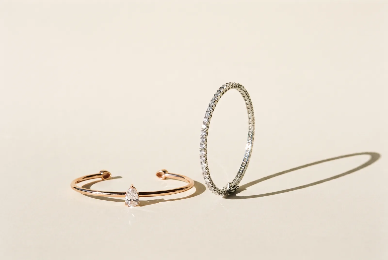 Two bracelets on a cream background
